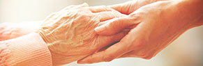 Elderly and young hands